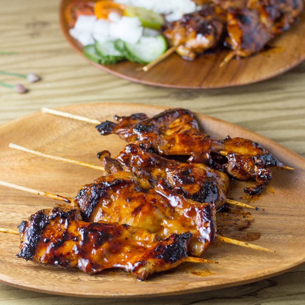 Filipino chicken barbecue skewered and served on a plate